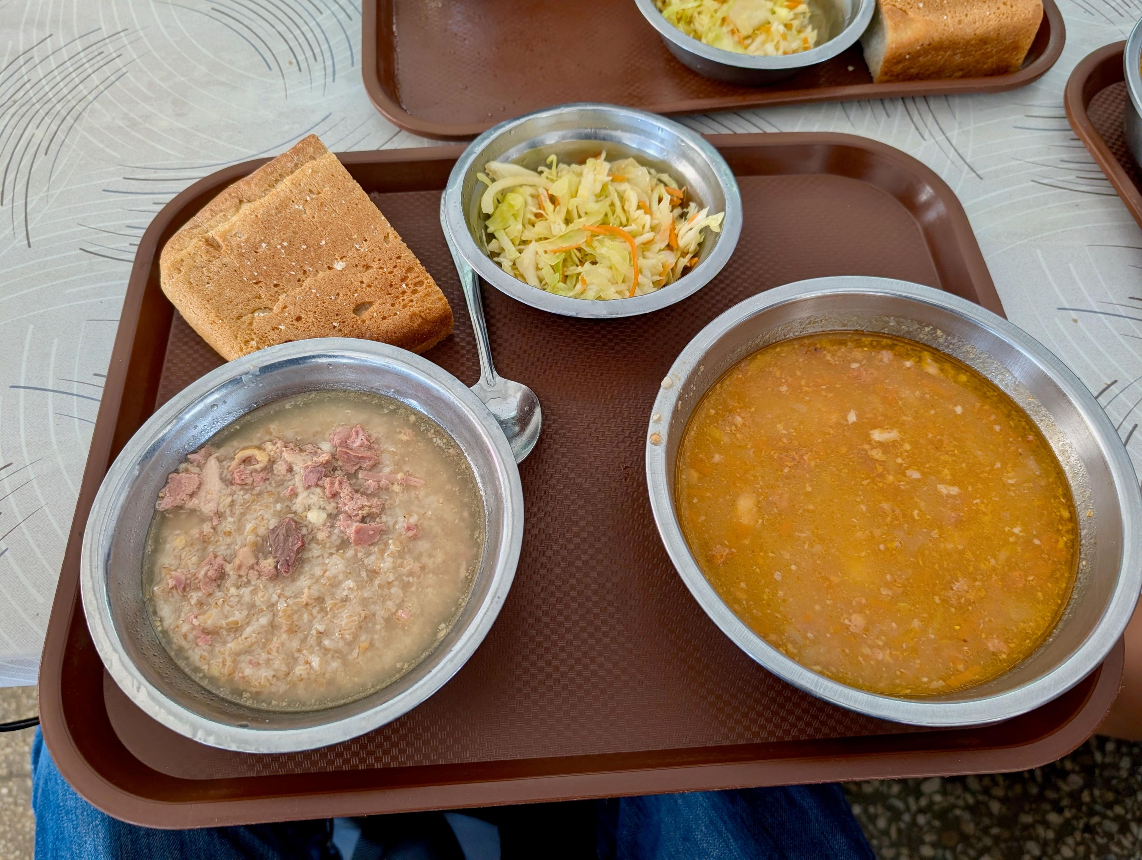 Image caption,While prisoners eat meals like this, a video plays in the background which debunks Russia's claim to Crimea
