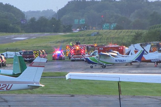 First responders gather at Carlisle Airport in Carlisle, Pennsylvania, following a fatal crash between a small plane and a state police helicopter on Wednesday.NBC Philadelphia