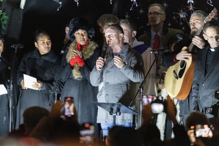 The far-right activist Tommy Robinson led a carol concert to ‘put the Christ back into Christmas’ in London in December.Photograph: Ilyas Tayfun Salci/Anadolu/Getty Images