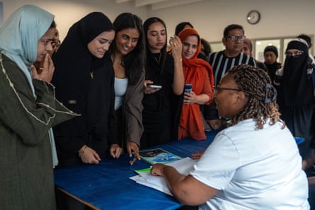 Students queue to receive their GCSE results at the Plashet City of London academy. London was once again the highest performing area with 28.6% of grades 7 and above.Photograph: Carl Court/Getty Images