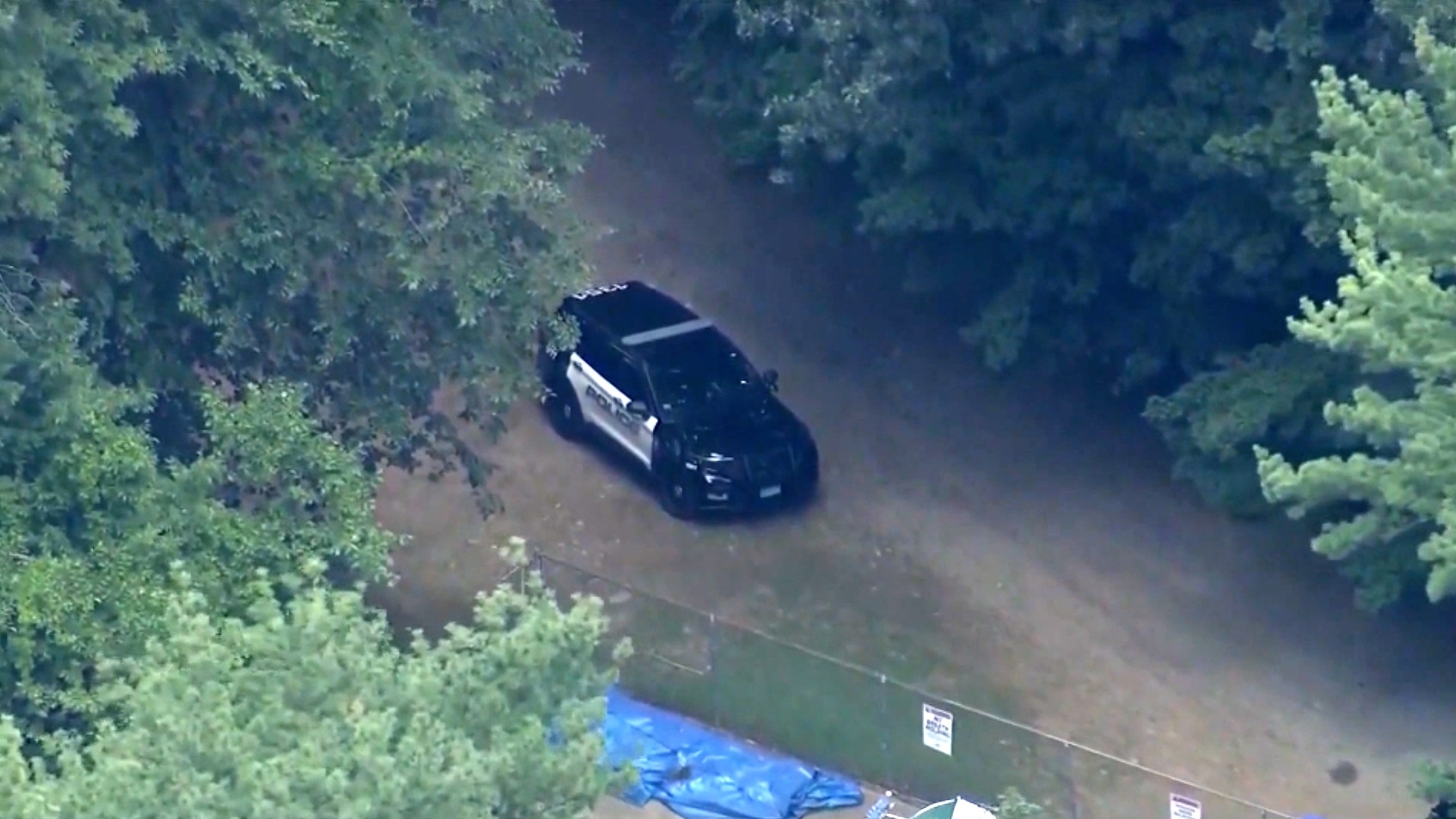 Police are seen at Camp Chickami in Wayland, Mass., Aug. 19, 2026, following the death of a camper.WBZ