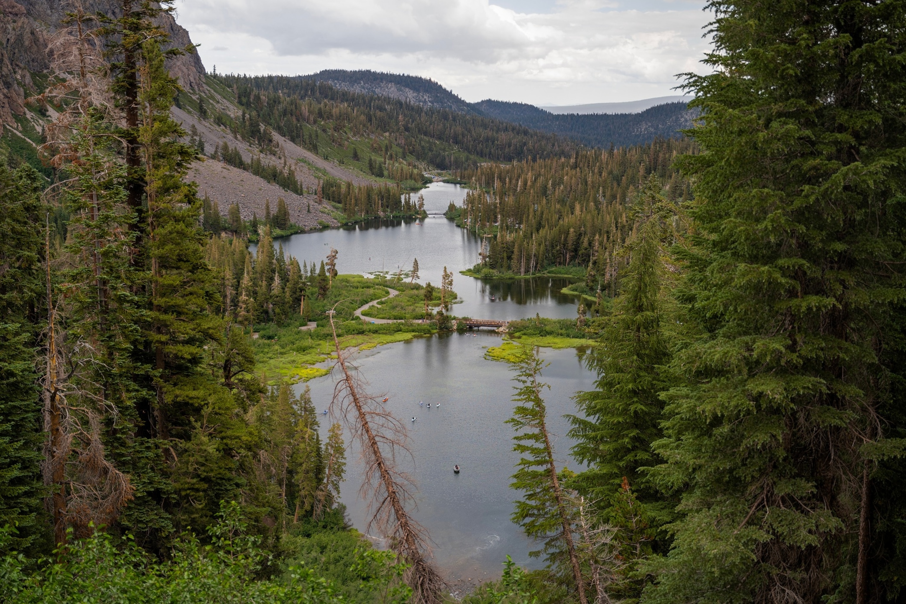 As you gaze upon the breathtaking view of George Lake in Mammoth Lakes, California, you find yourself immersed in a scene of unparalleled natural beauty. The lake is nestled within the majestic Eastern Sierra region, surrounded by rugged mountains that reflect on the crystal-clear waters.Getty Images