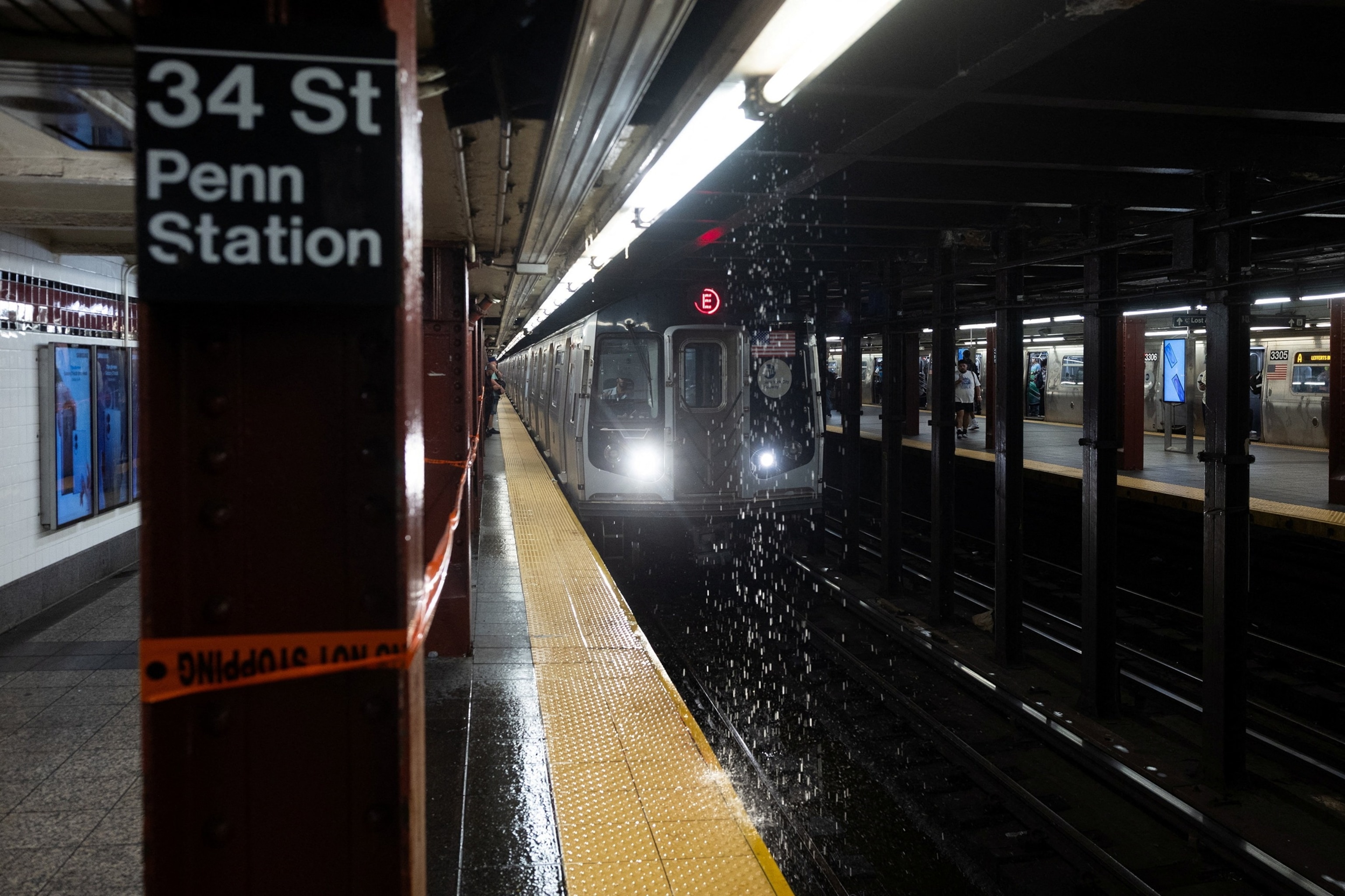 Rain leaks into the Penn Station Subway Station during a severe rain storm in New York, U.S., August 20, 2026.Jordan Tovin/Reuters