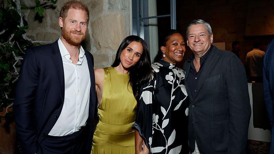Image caption,Harry and Meghan with Netflix CEO Ted Sarandos and wife Nicole Avant