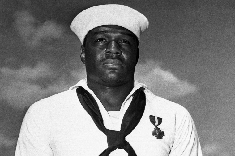 The unnamed hero of Pearl Harbor, a messman with the United States Fleet, has been identified as Dorie Miller of Waco, Texas, seen here wearing the cross he received at a ceremony.Bettmann Archive/Getty Images file