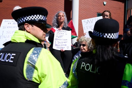 Police and supporters of the ‘Barclays five’ outside Preston crown court on Friday.Photograph: Christopher Thomond/The Guardian
