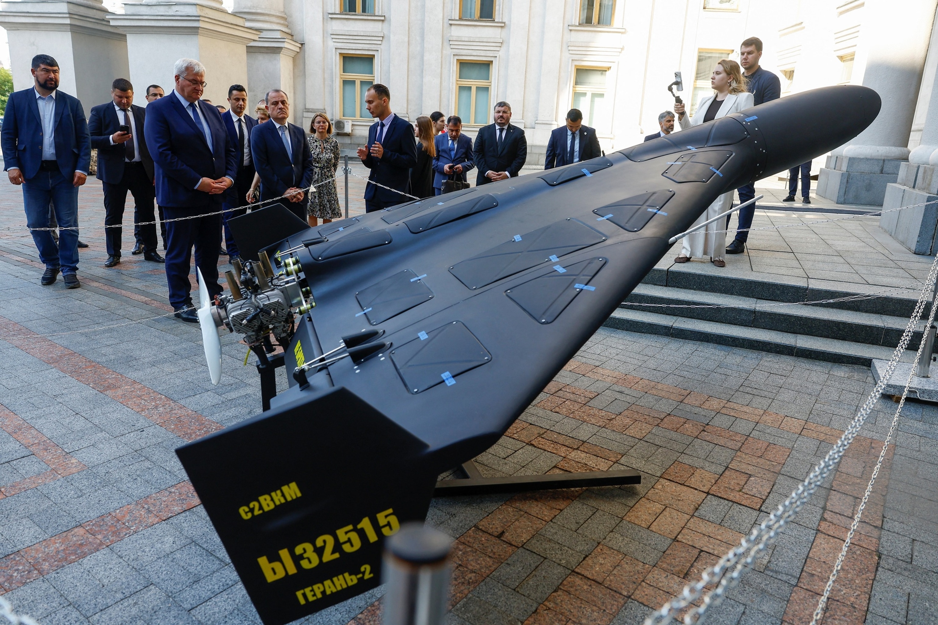 Ukrainian Foreign Minister Andrii Sybiha and his Azerbaijani counterpart Jeyhun Bayramov look at a Russian Geran-2 drone in Kyiv, Ukraine, on Aug. 6, 2026.Valentyn Ogirenko/Reuters