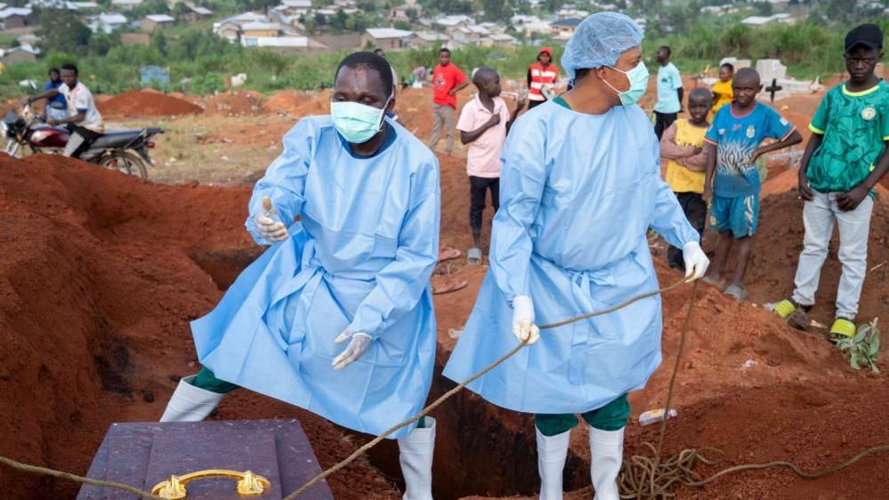 Image caption,Strict protocols now need to be observed around burials to ensure that the virus does not spread from the infected body