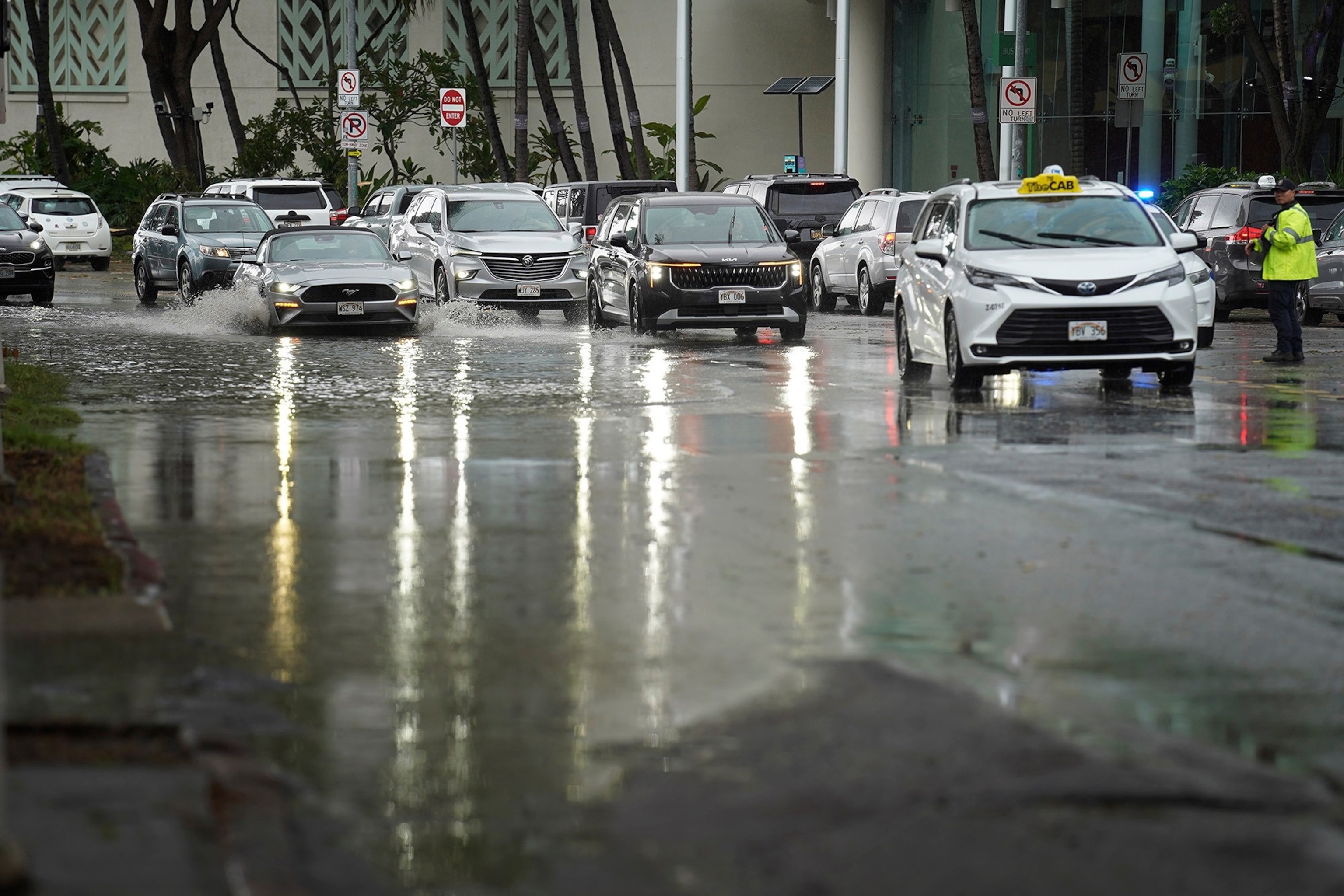 Tropical Storm Lala's rain floods Kapiolani Boulevard in front of the Hawaii Convention Center, Aug. 16, 2026, in Honolulu.Kevin Fujii/AP