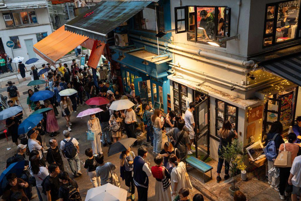 Image caption,Hong Kong has lost many independent bookshops over the years - regulars gathered at Mount Zero on its last day in March 2024