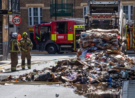 Bin lorry fire in Lafone Street, south London. There has been a rise in fires caused by electrical products using lithium-ion batteries, such as strimmers, drills, power banks and e-scooters.Photograph: Jill Mead/The Guardian