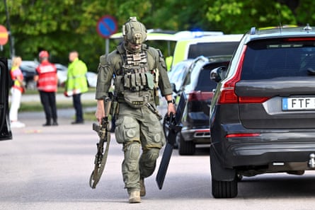Armed police officers were dispatched to Brinellskolan as an 18-year-old wielded a sword, attacking students.Photograph: Fredrik Sandberg/TT/Reuters