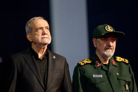Masoud Pezeshkian and Mohsen Rezaei, right, at a memorial for Iran’s late supreme leader Ayatollah Ali Khamenei in July.Photograph: Mohammed Salem/Reuters