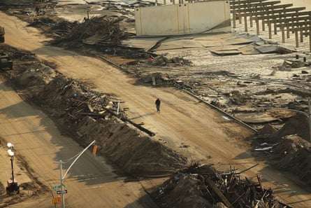 Debris where a section of the iconic boardwalk in the Rockaway neighborhood of Queens, New York City, was washed away on 10 November 2012.Photograph: Spencer Platt/Getty Images