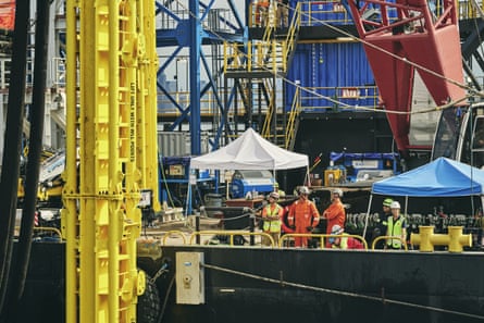 Crews who will lay cable to connect the Empire Wind farm to New York City’s grid, in New York Harbor on 17 July 2025.Photograph: Bryan Derballa/Bloomberg via Getty