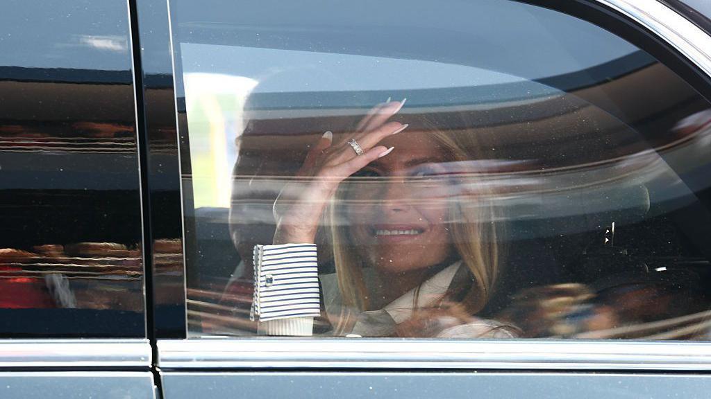 Image caption,Melania Trump waved to fans from the track