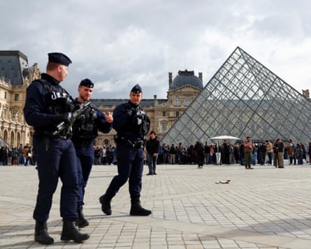 Police outside the Louvre in Paris, where there was a heist last October.Photograph: Abdul Saboor/Reuters