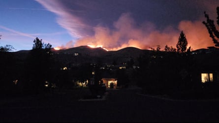 Smoke and flames rise from Hawk fire in Nevada on 22 August.Photograph: @SquintDev/Reuters