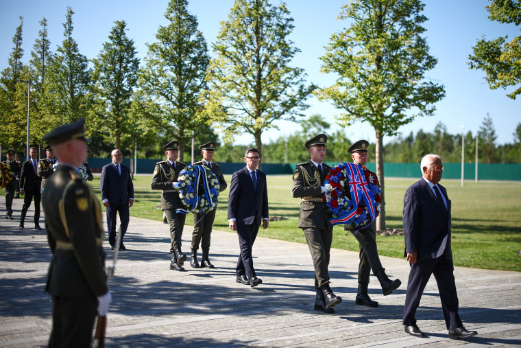 European leaders during a wreath-laying ceremony at Ukraine's National Military Memorial Cemetery on Monday.Henry Nicholls / AFP via Getty Images