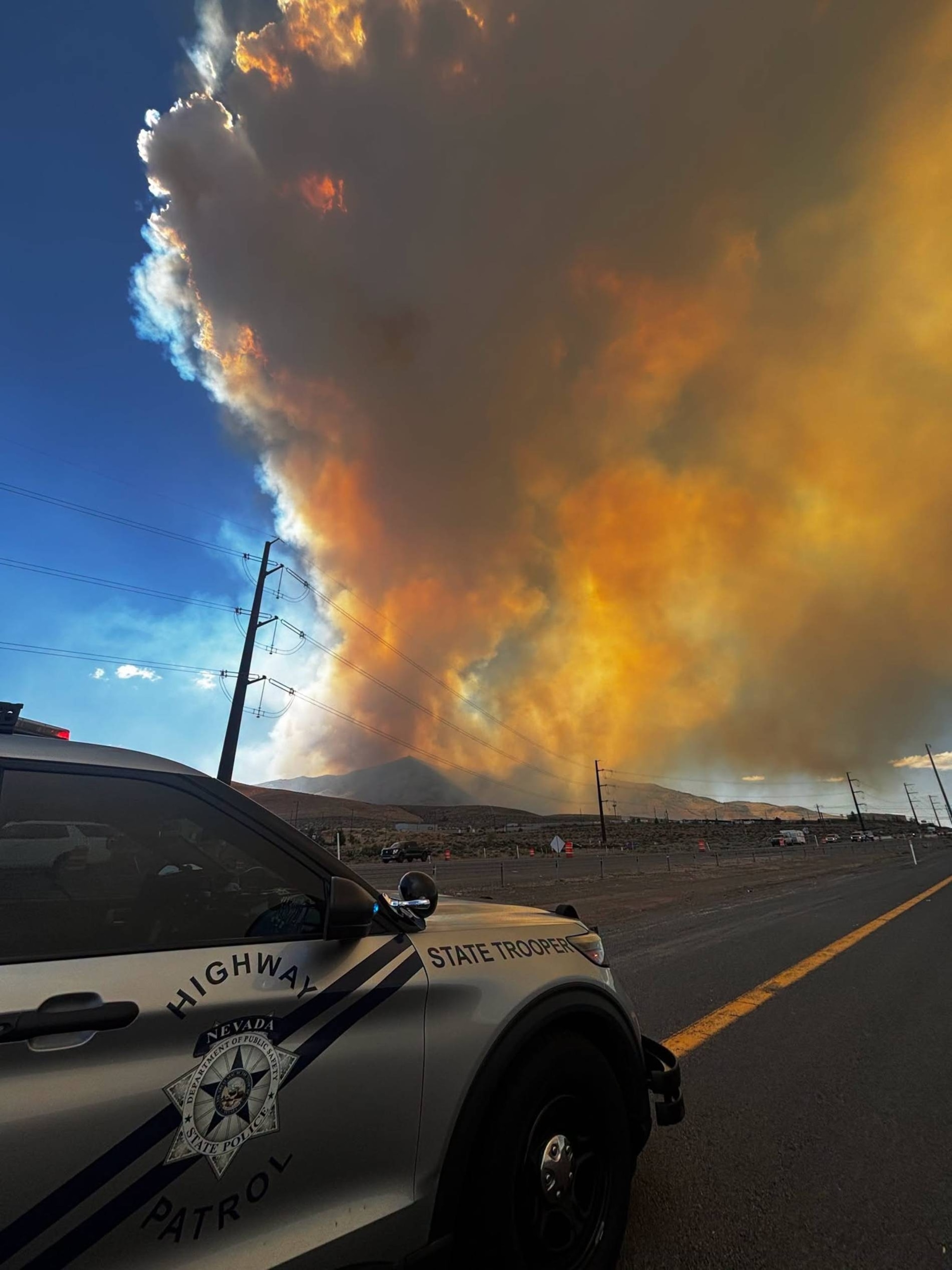 The Hawk Fire seen in the hills near Reno, Nevada, August 22, 2026, has grown to more than 10,000 acres and is threatening hundreds of homes, officials said.Truckee Meadows Fire Protection District