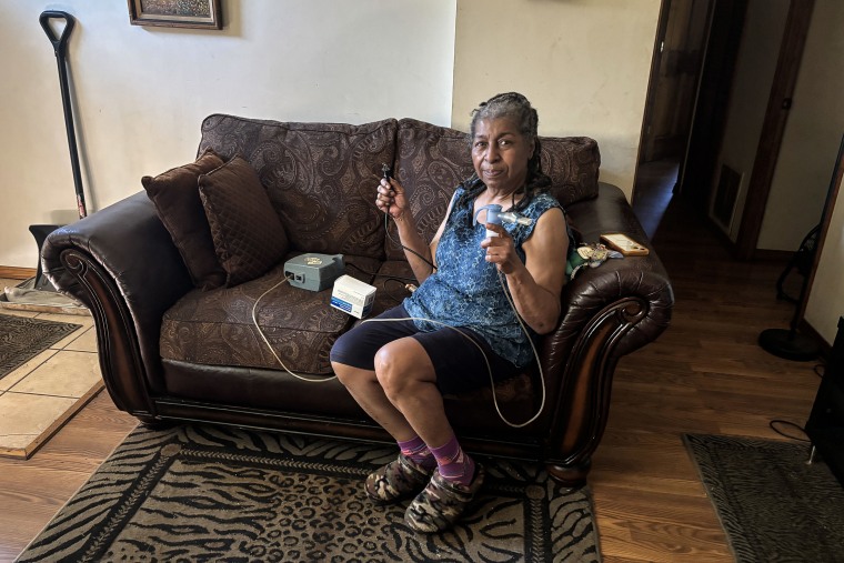 Lifelong Gary, Ind., resident Joetta Walker, 73, holds her nebulizer.Selina Guevara / NBC News