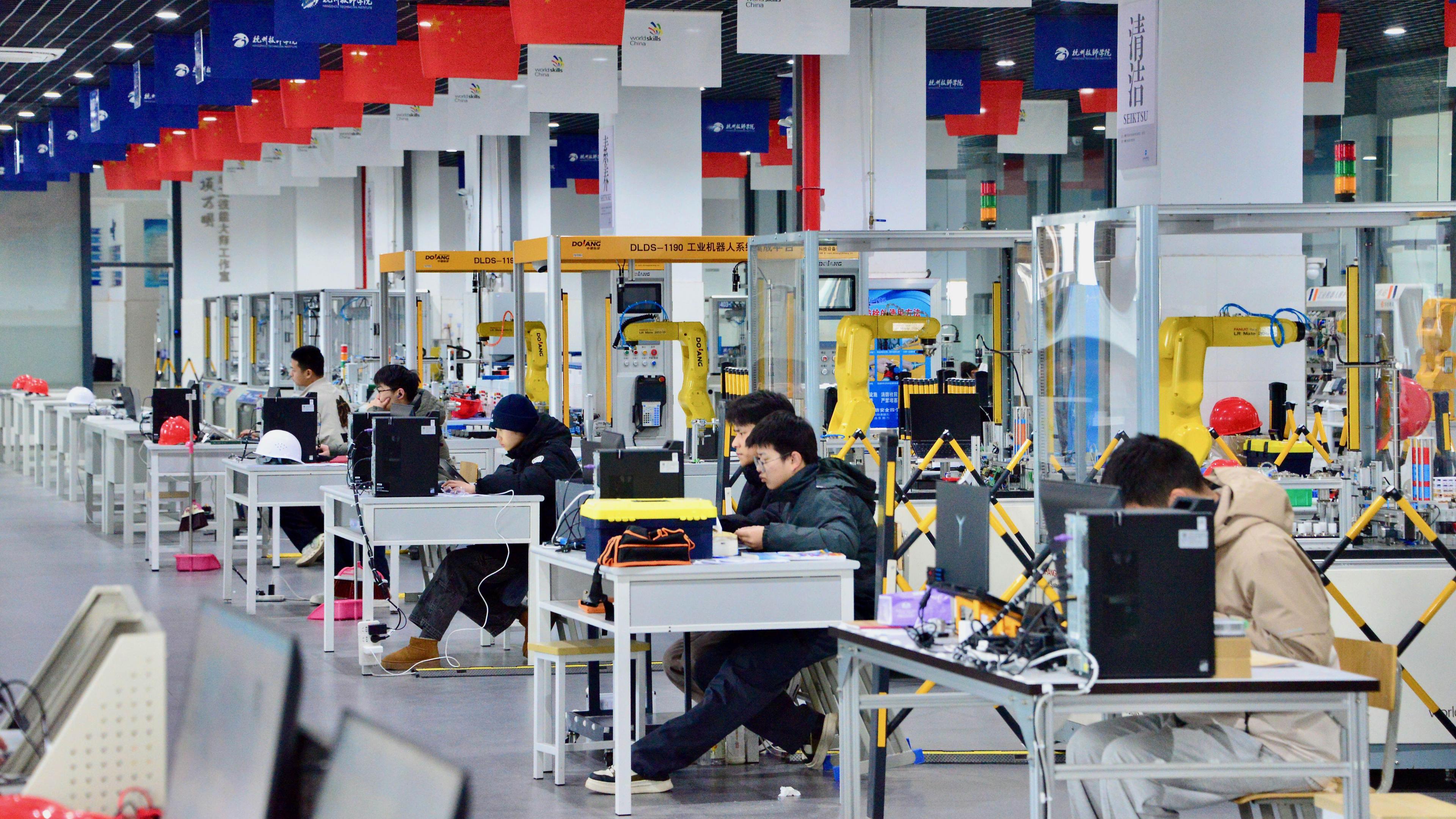 Image caption,Students learning robotics at the Hangzhou Technician Institute, one of many new vocational schools