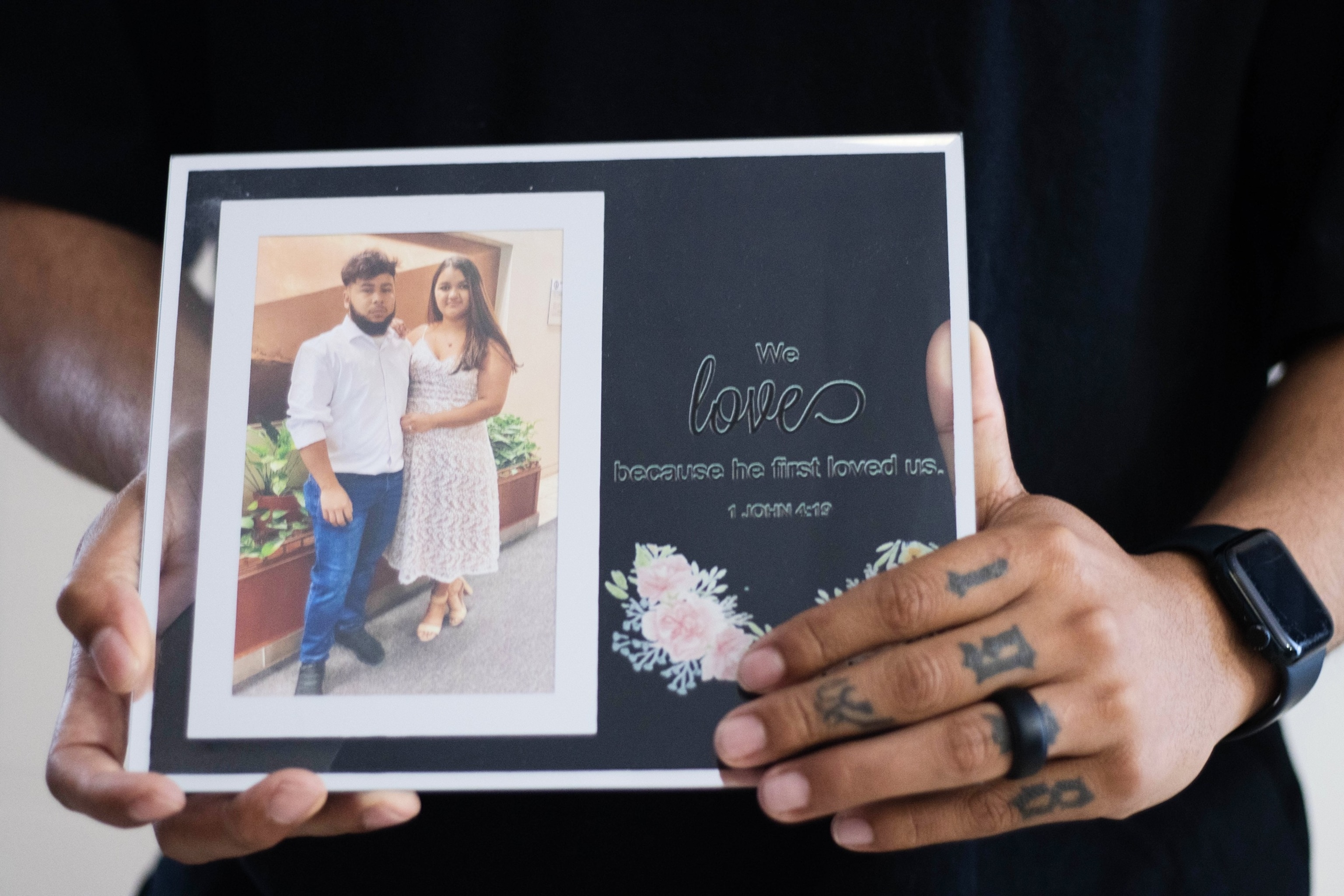 Army Sgt. Hedar Leonel Turcios Juarez holds a picture of himself with with his wife Cristy, who is currently on immigration detention, at home in El Paso, Texas, July 21, 2026.Ryan Romero/AP Photo