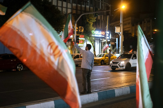 People walk past shops and browse for goods at the Grand Bazaar in Tehran on Monday.AFP via Getty Images