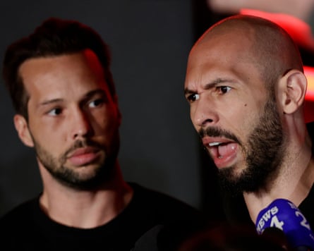 Andrew Tate (right) and his brother, Tristan, speak to reporters in Bucharest in March 2025.Photograph: Robert Ghement/EPA-EFE/Shutterstock