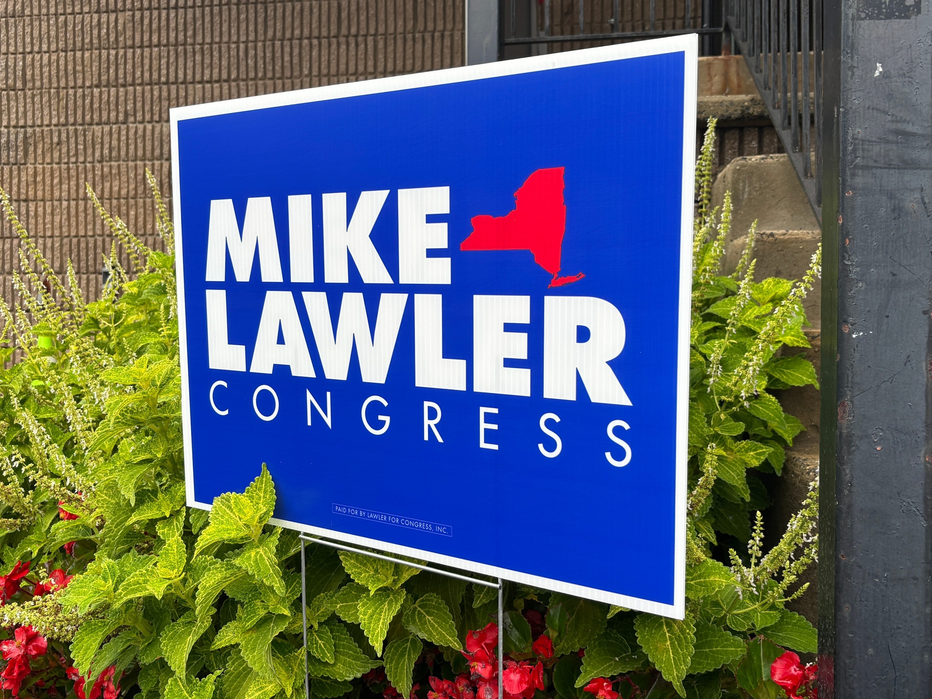 A sign in support of Rep. Mike Lawler outside a campaign event in Haverstraw, New York.Jared Kofsky/ABC News