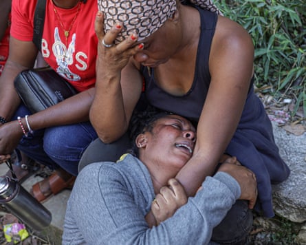 Women mourn at the site of the attack in Kenscoff.Photograph: Patrice Noel/Reuters