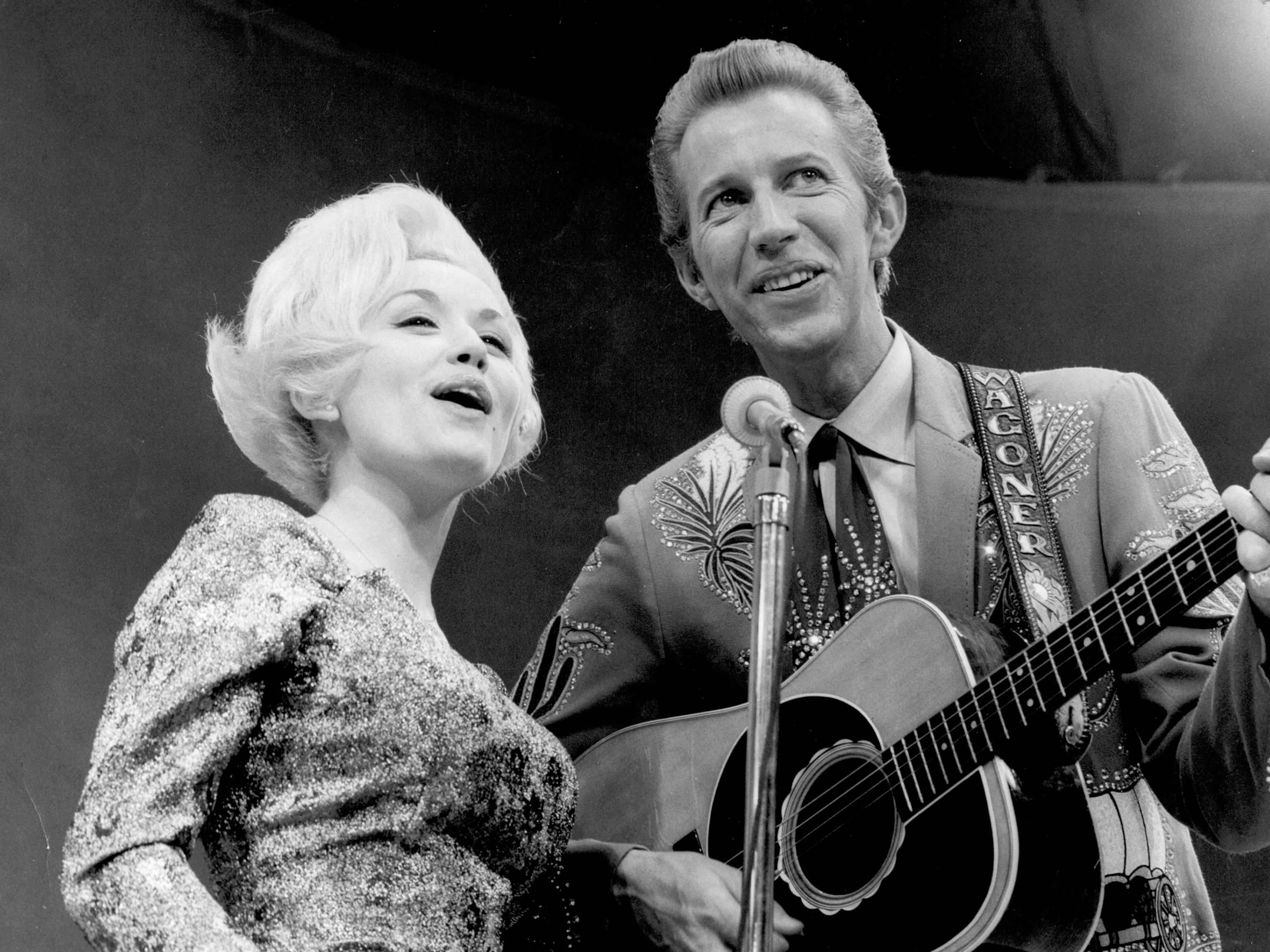 Country singer Dolly Parton and her collaborator Porter Wagoner perform onstage circa 1967.Michael Ochs Archives/Getty Images