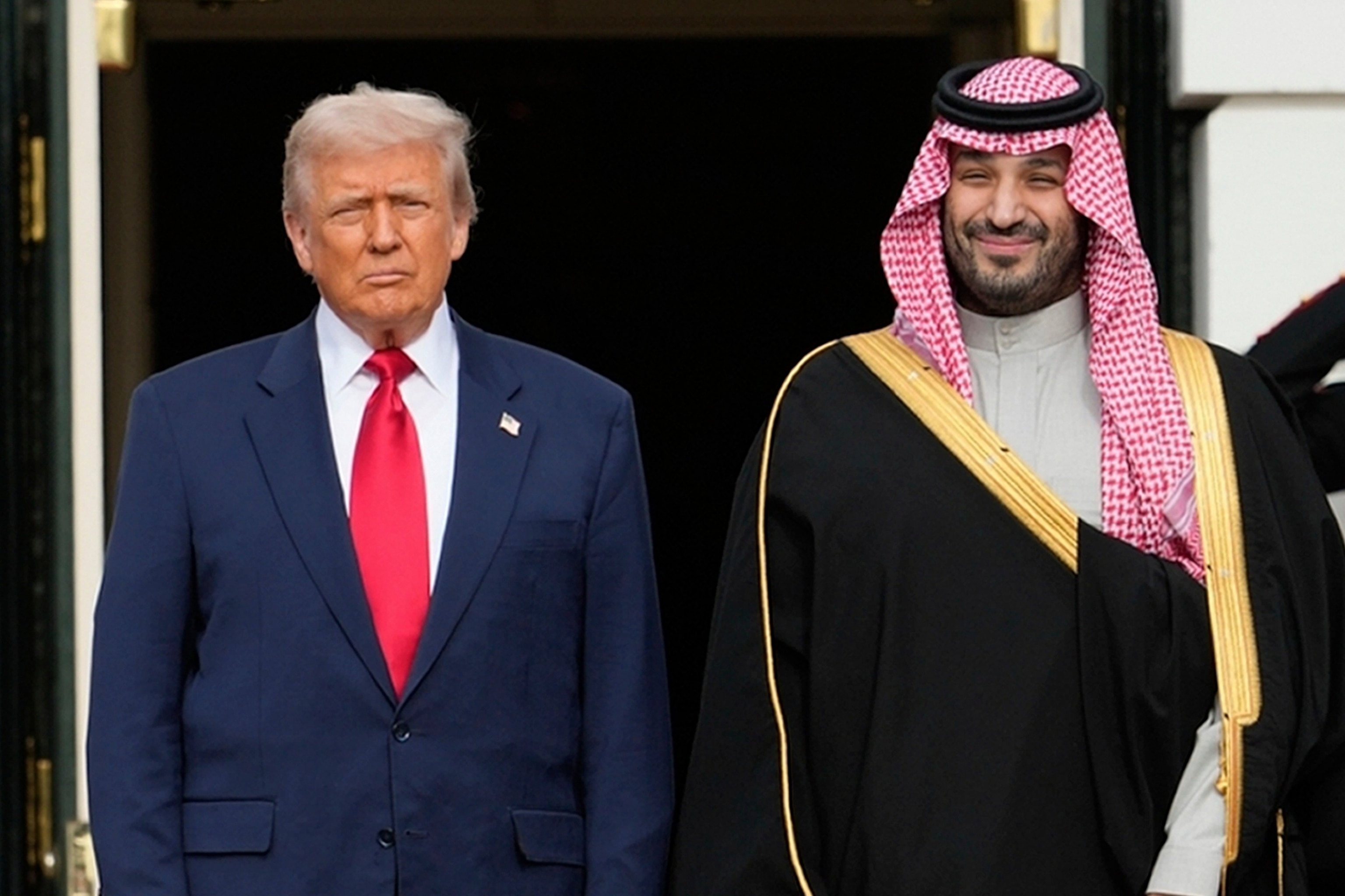President Donald Trump stands with Saudi Arabia's Crown Prince Mohammed bin Salman on his visit to the White House, Nov. 18, 2025, in Washington.Mark Schiefelbein/AP Photo