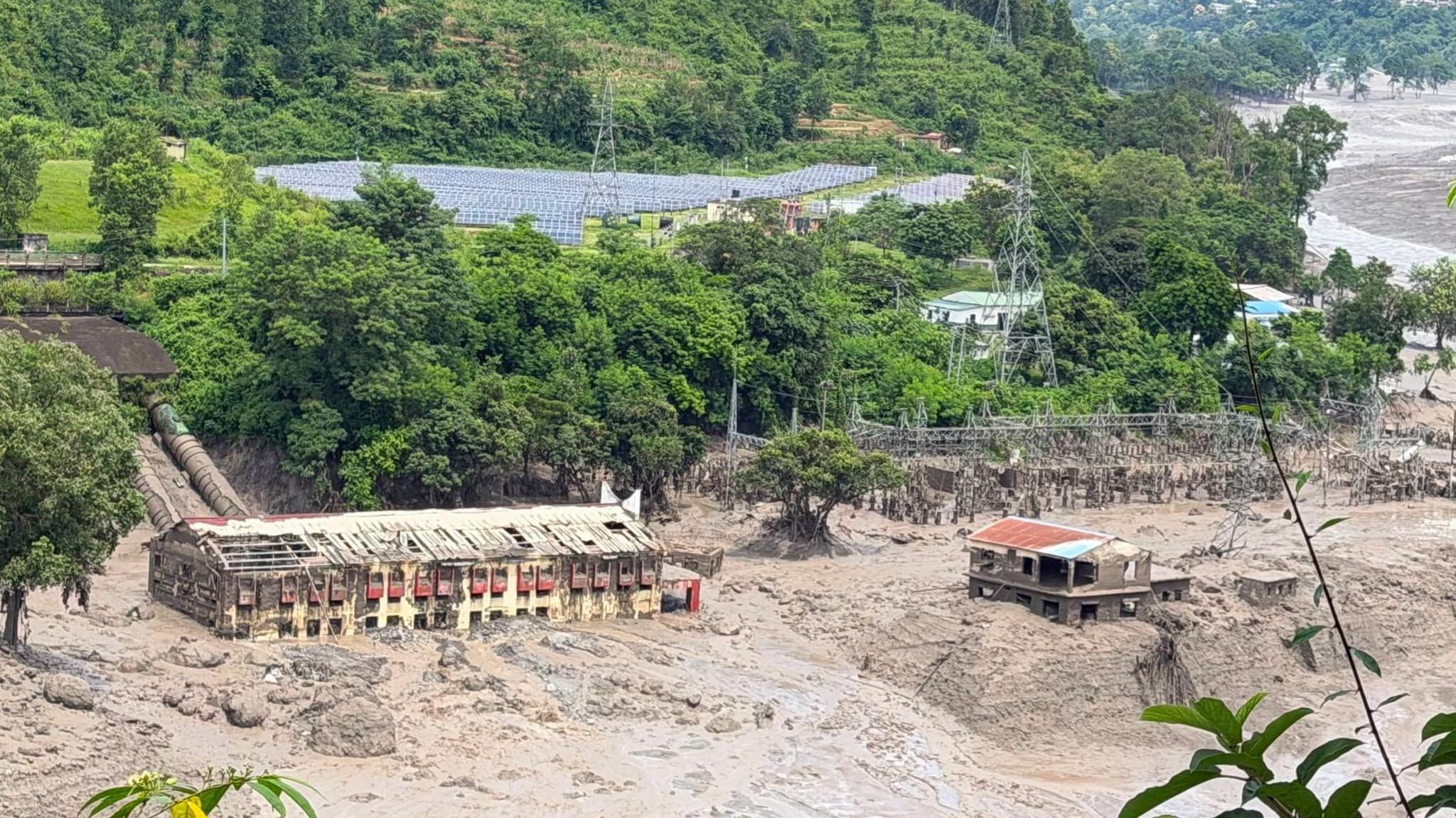 Image caption,Mud and sand could be seen piled up against a hydropwer plant