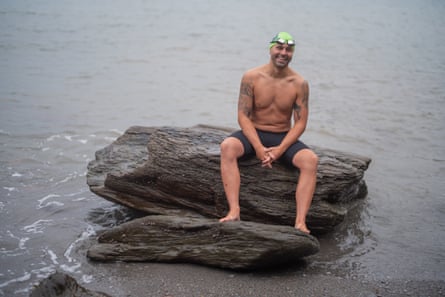 Neil Gilson, seen here on Sandy Cove beach, trained for his Swiss lakes challenge in the sea off North Devon.Photograph: Jim Wileman/The Guardian