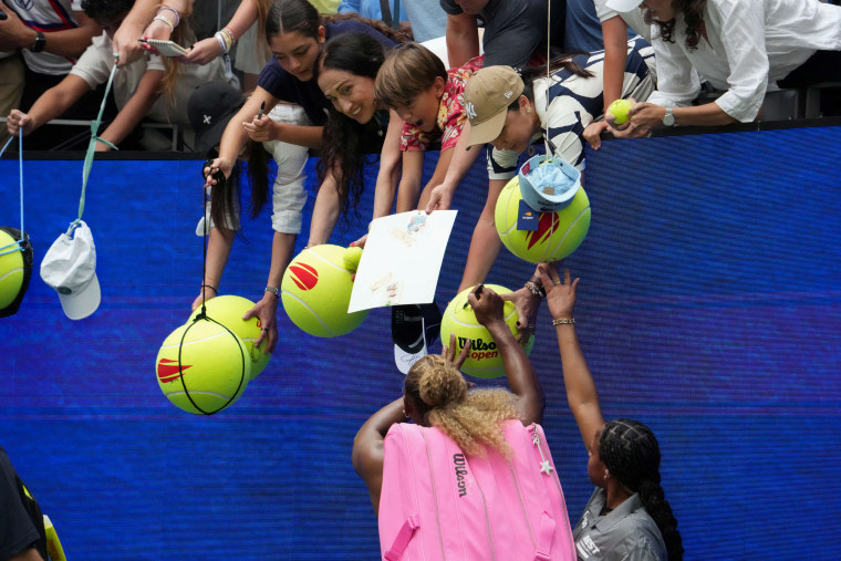 Serena Williams signs autographs for fans in New York on Tuesday.Timothy A. Clary / AFP via Getty Images