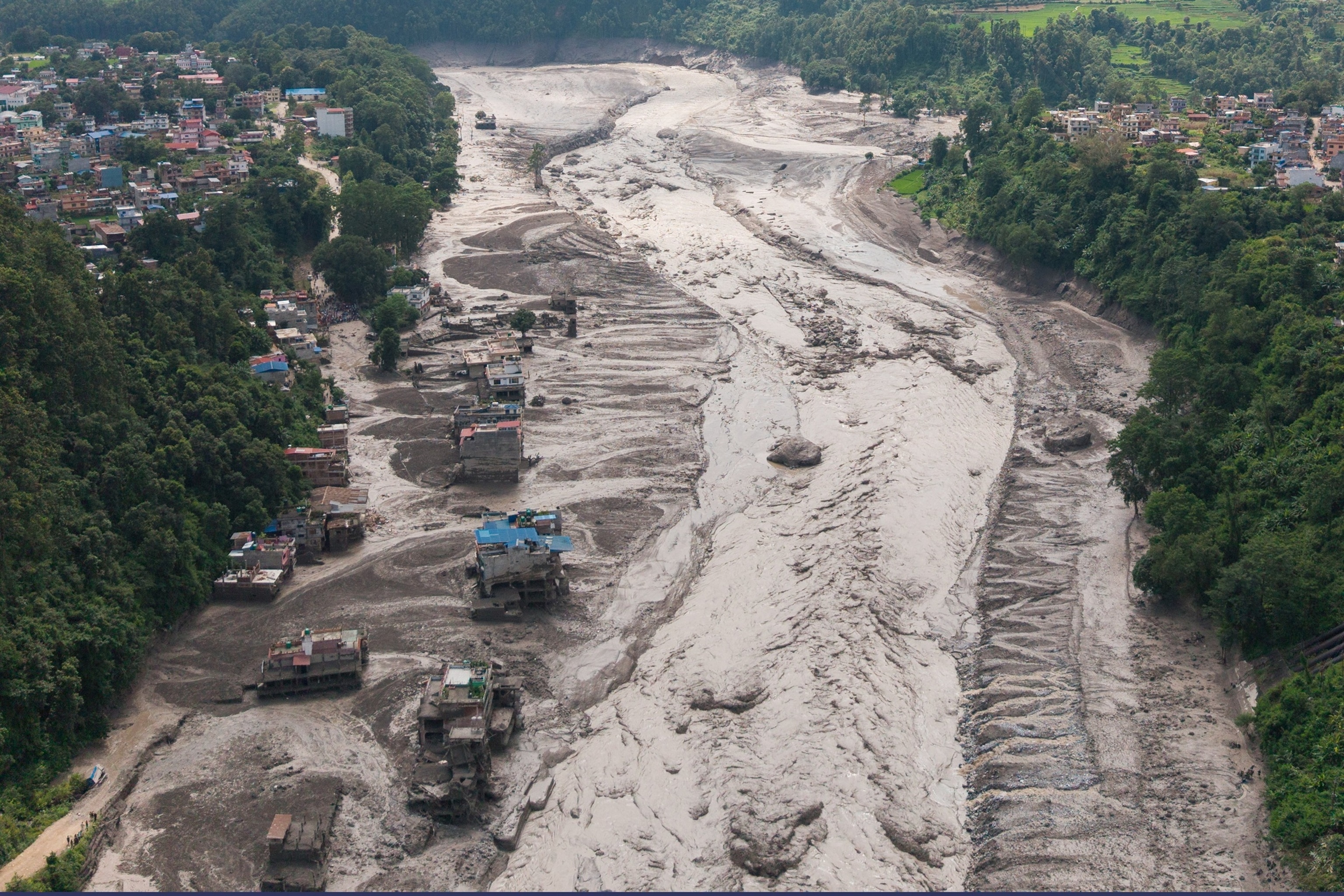 A drone view shows mud covering properties following a flash flood at Trishuli in Nuwakot district, Nepal, August 26, 2026.Reuters