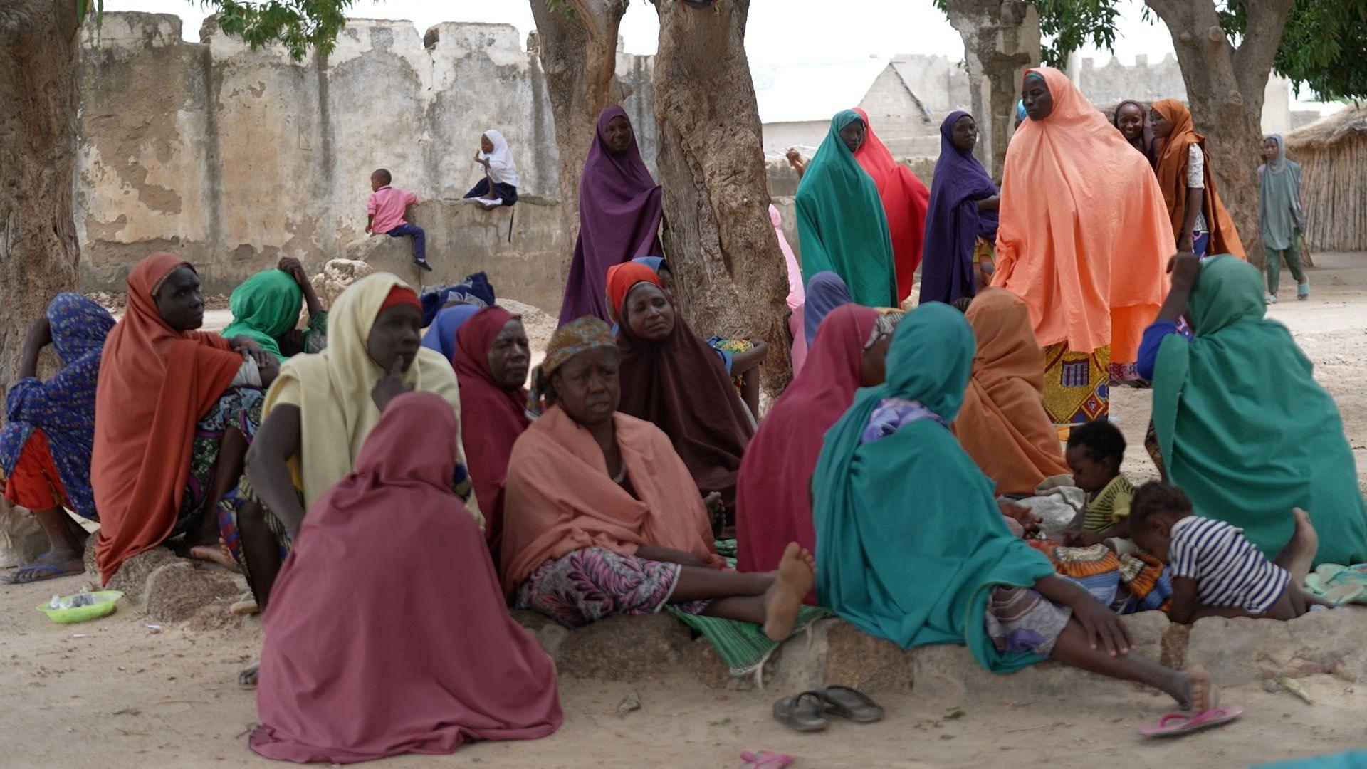Image caption,There is little food and nowhere comfortable to sleep in the makeshift camp in Gusau where Fatima is now living