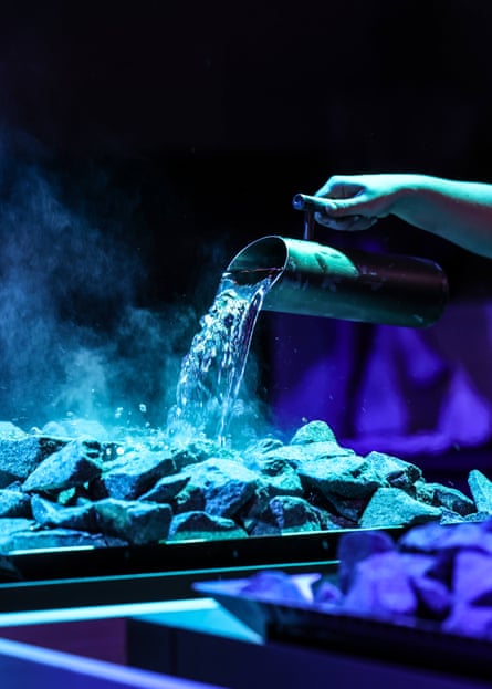 Aufguss involves placing an infusion on a stove and circulating the fragrant steam through choreography.Photograph: Victoria Haydn/Therme Manchester