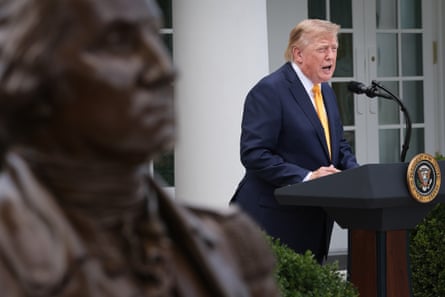 Donald Trump in the Rose Garden, next to a statue of George Washington, at the White House in Washington DC on 24 August.Photograph: Win McNamee/Getty Images