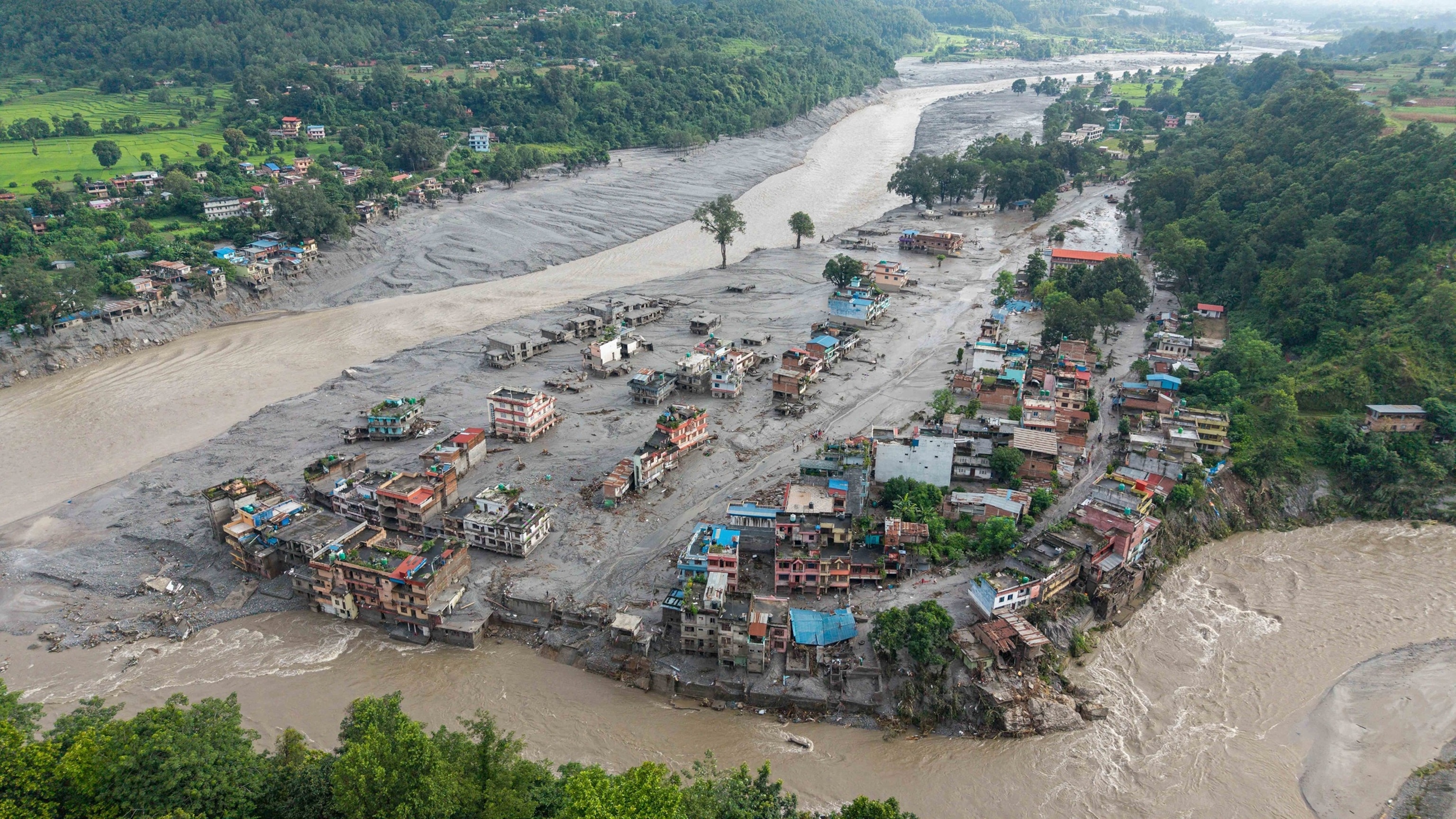 This graphic shows destruction along the path of a landslide and subsequent flash flood along the Nepal-Tibet border.Felt Maps/ABC News