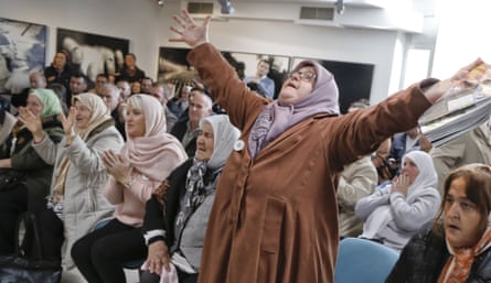 Ediba Salihović raises her hands as she reacts with other Bosnian women upon hearing the sentence at the end of Mladić’s trial in Potočari, near Srebrenica, in November 2017.Photograph: Amel Emrić/AP