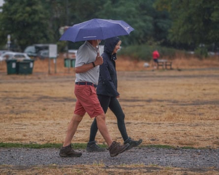 Rain falls on parched ground after a succession of heatwaves in England and Wales.Photograph: Amer Ghazzal/Shutterstock