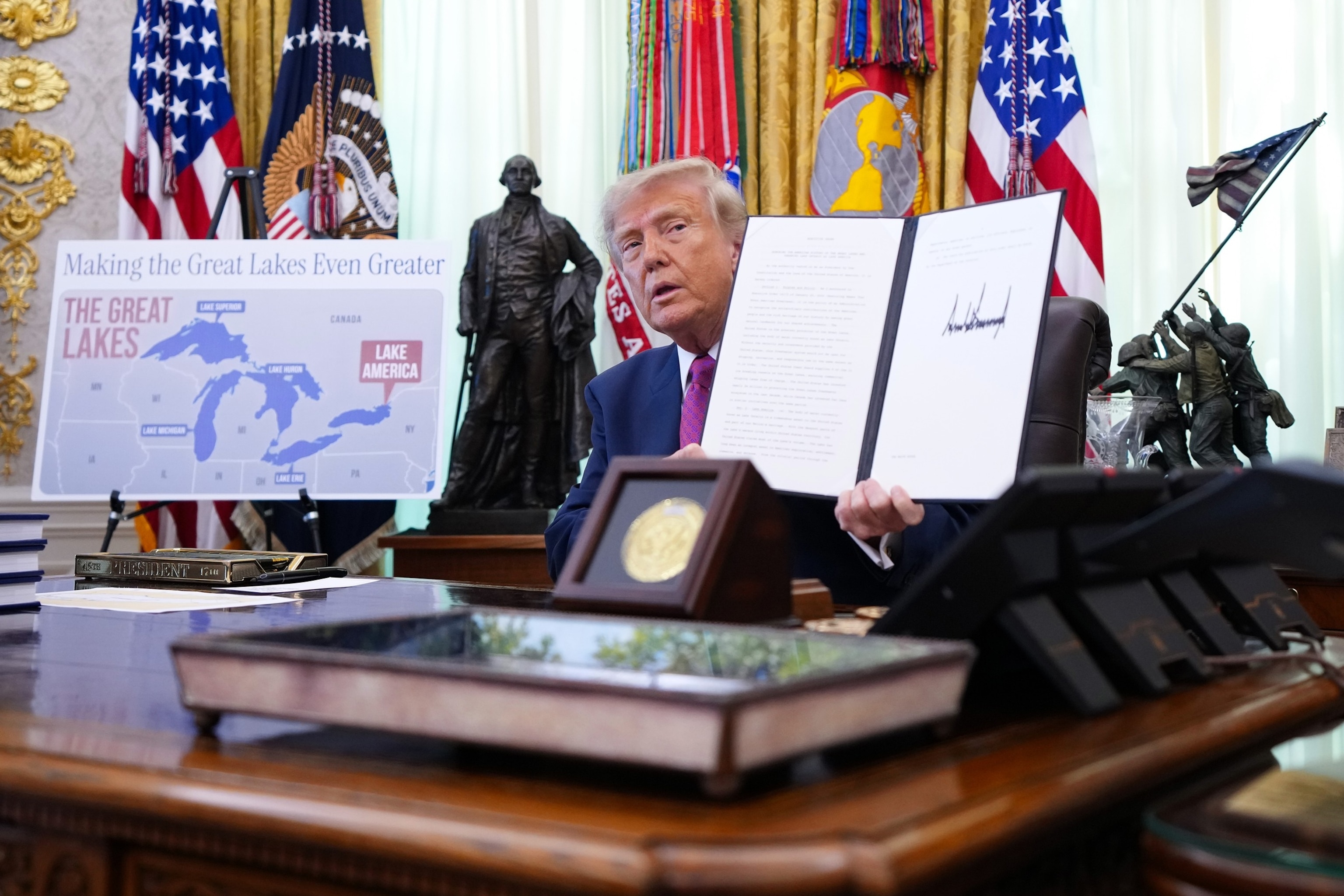 President Donald Trump displays a signed executive order during an event in the Oval Office of the White House, August 27, 2026 in Washington.Andrew Harnik/Getty Images