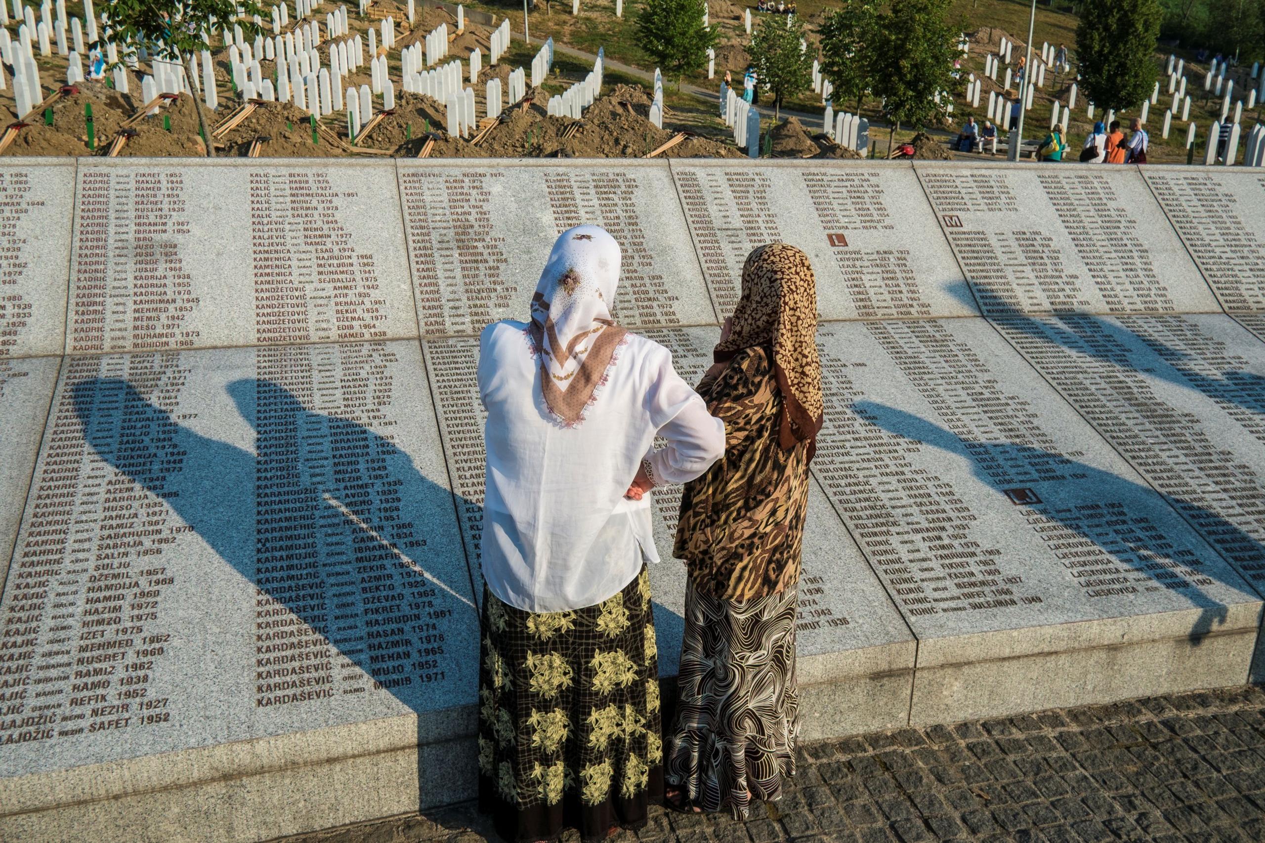 Image caption,Two women at the Srebrenica-Potocari memorial and cemetery for victims of the Srebrenica massacre in 1995