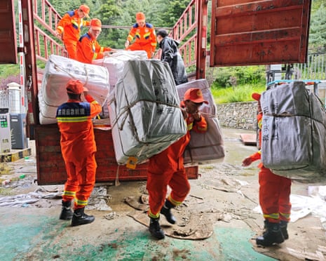 Rescue workers carrying relief supplies in Gyirong county in Shigatse, Tibet Autonomous Region, China, on Thursday.Photograph: China Daily/Reuters