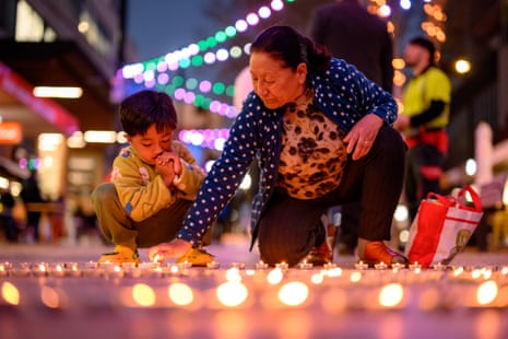 Candles arranged in the shape of the Nepali flag at prayers in Rockdale, Sydney.Photograph: George Chan/AAP