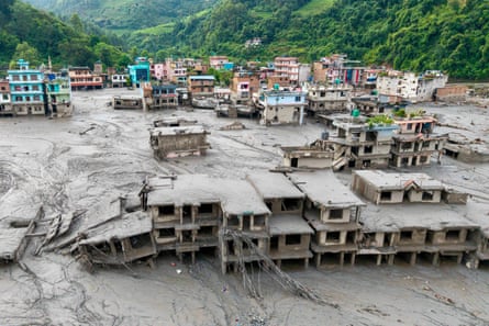 Sludge inundates homes after flash floods in Nuwakot district.Photograph: AFP/Getty Images