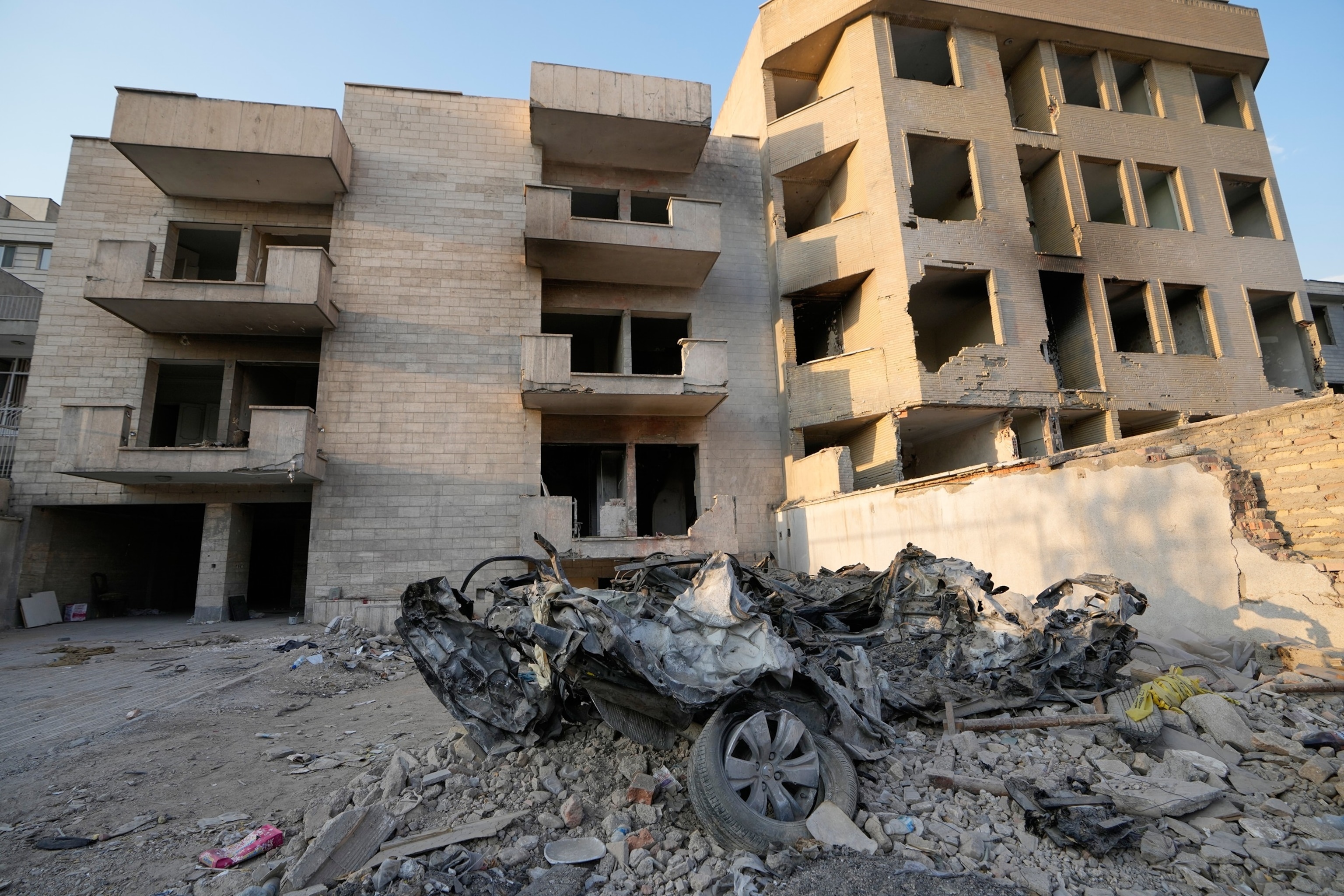 Cars and residential buildings damaged in a U.S.-Israeli strike on March 8 remain in ruins in Tehran, Iran, Aug. 27, 2026.Vahid Salemi/AP