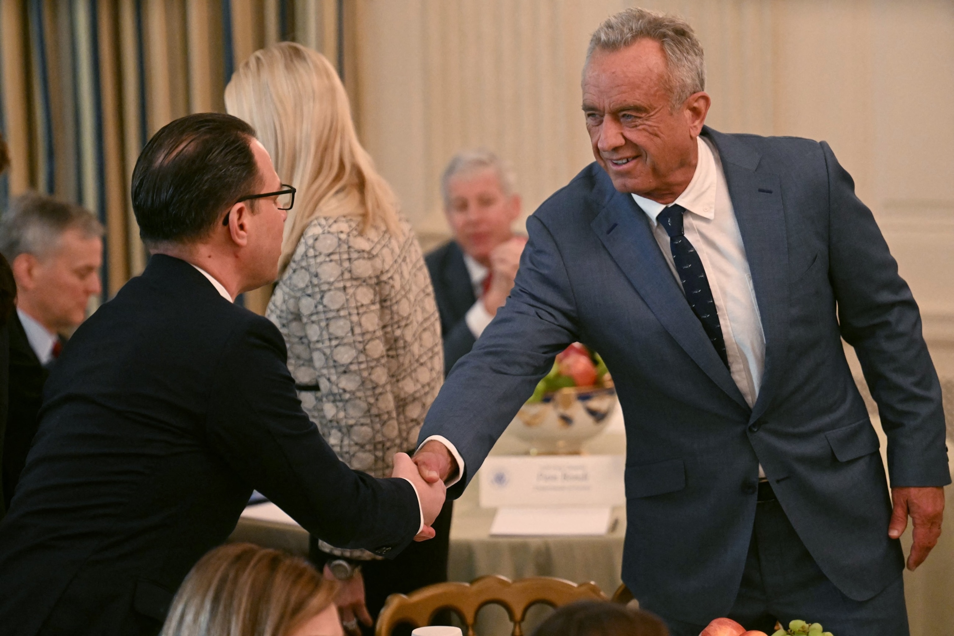 US Secretary of Health and Human Services Robert F. Kennedy Jr. greets Pennsylvania Governor Josh Shapiro as they attend the Governors Working Session at the White House in Washington, February 21, 2025.Jim Watson/AFP via Getty Images